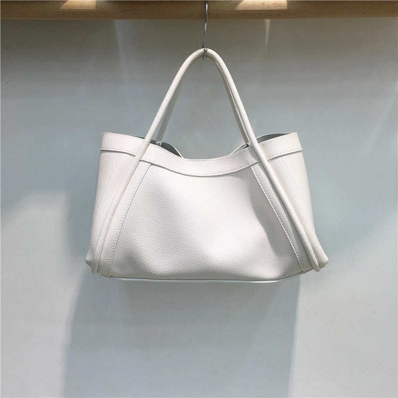 Women's structured everyday tote bag in a versatile color, perfect for work, travel, or daily essentials.
