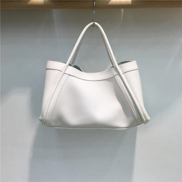 Women's structured everyday tote bag in a versatile color, perfect for work, travel, or daily essentials.