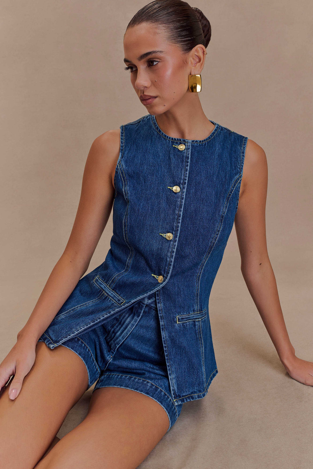 Fashionable women's two-piece summer outfit: a chic sleeveless top paired with comfy high-waist shorts.