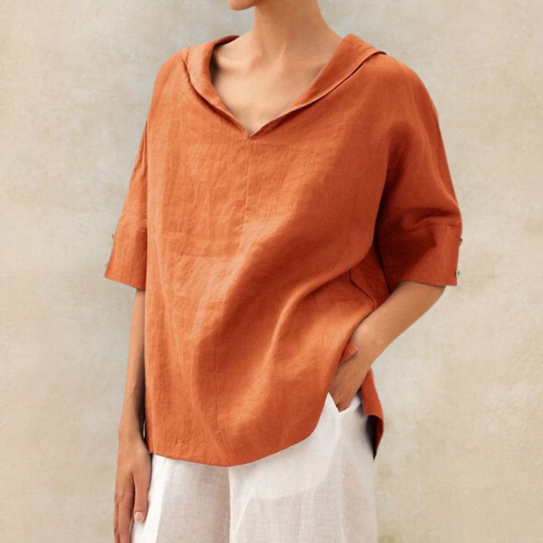 Stylish women's V-neck blouse with a relaxed fit and elbow sleeves, perfect for casual or work wear.