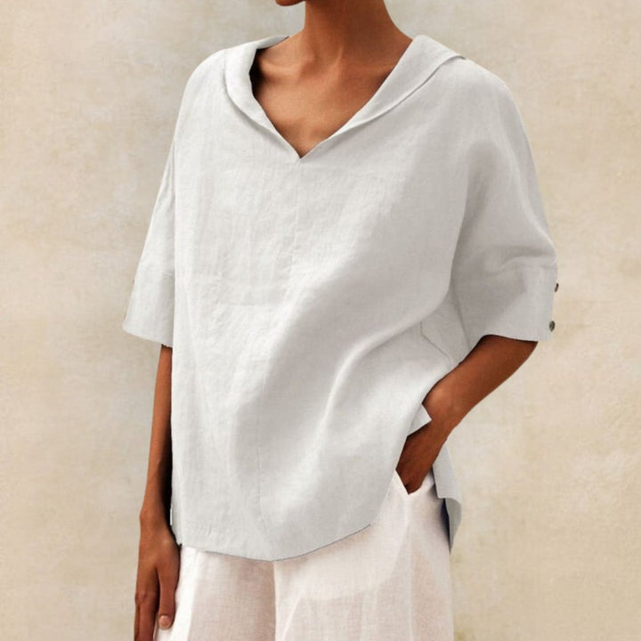 Versatile women's V-neck blouse, relaxed fit, elbow sleeves. A stylish and comfortable top for any occasion.