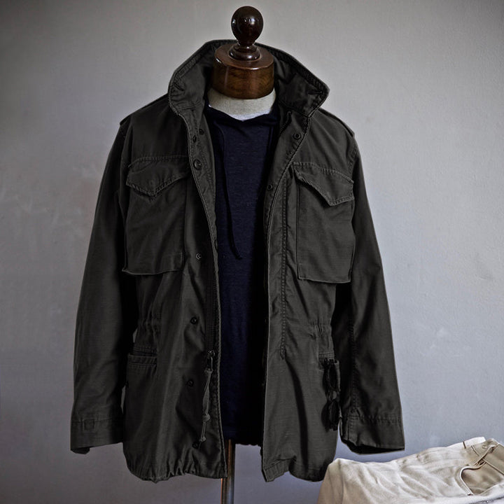 Stylish & durable women's vintage military jacket with a hidden hood, perfect for all-weather outdoor and casual wear.