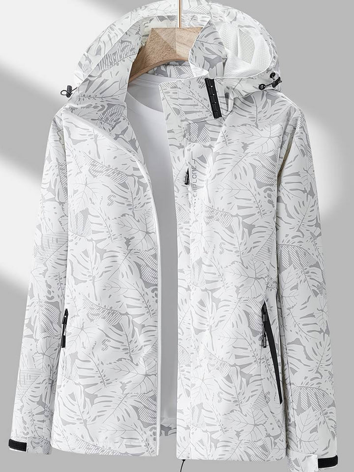 Lightweight women's hooded jacket, stylish and waterproof. Ideal for activewear or casual outdoor adventures.