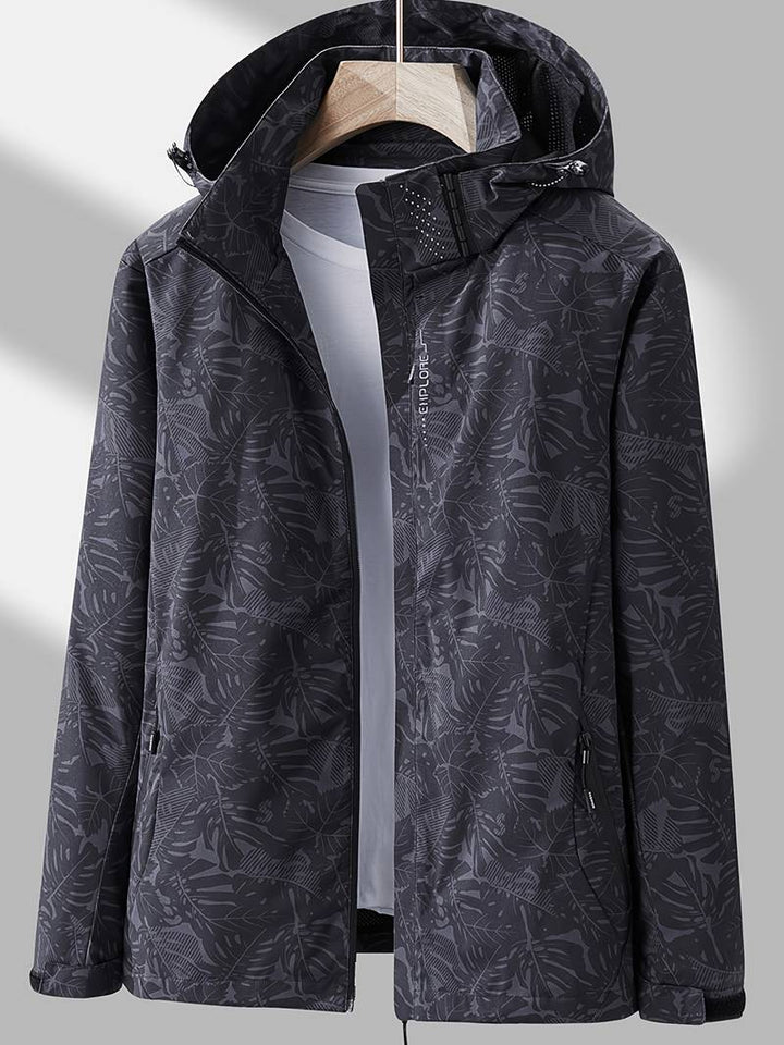 Lightweight women's waterproof hooded jacket, sleek design for active and casual wear. Windproof outerwear.