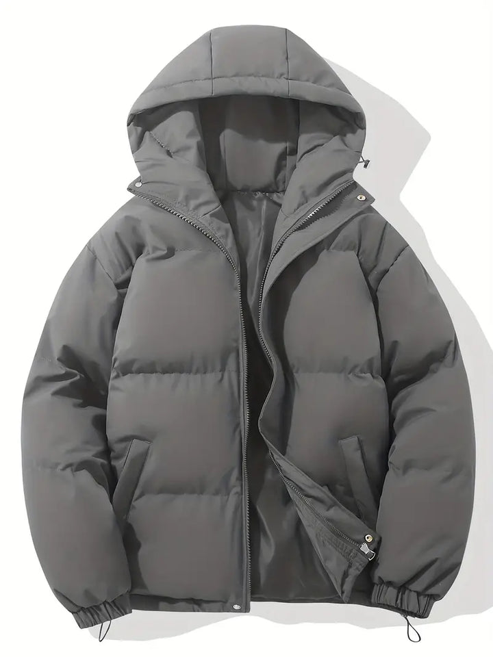 Modern women's hooded winter jacket, designed for stylish warmth and comfort in chilly everyday wear.
