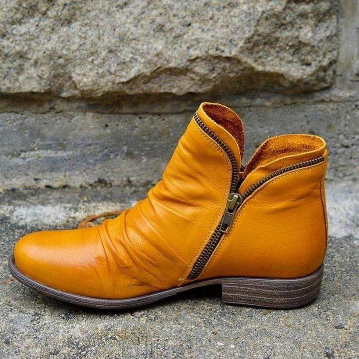 Chic women's zip-up ankle boots with a sleek design. Ideal for both casual and dressy outfits.