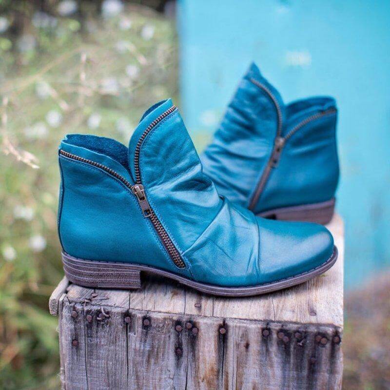 Modern women's zip-up ankle boots. These chic and stylish boots offer effortless comfort & versatility.