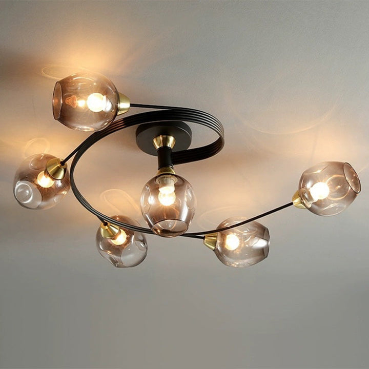 Sleek gold flush mount ceiling light, enhancing a modern living room or entryway.