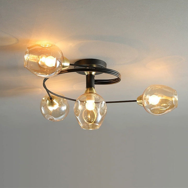 Elegant amber Tavin flush mount, sculptural ceiling fixture for modern bedroom ambiance.