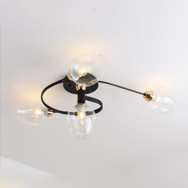 Sculptural smoke grey Tavin flush mount, modern ceiling fixture for stylish bedroom.