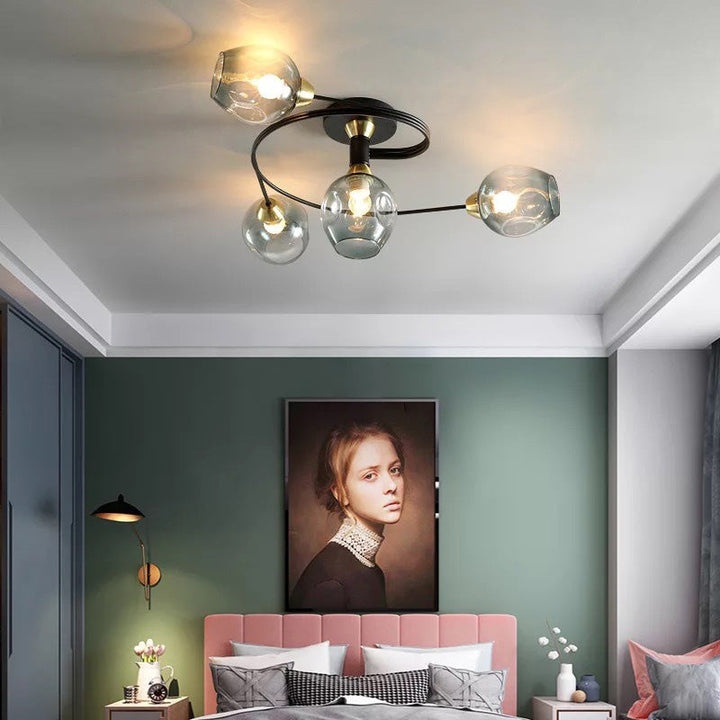 Elegant black Tavin flush mount, a sculptural ceiling fixture for modern bedroom lighting.