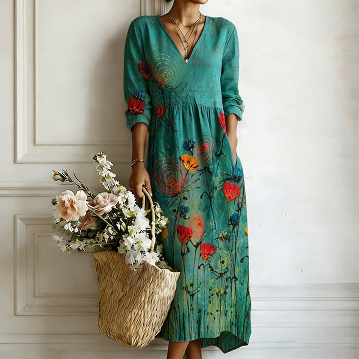 Teal artistic floral v-neck maxi dress with flowy bohemian style, perfect for summer.