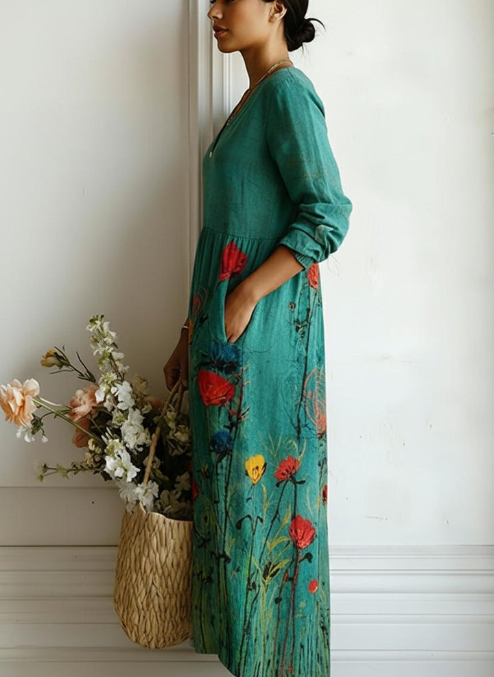 Bohemian floral print maxi dress in teal, featuring a flattering v-neck and 3/4 sleeves.