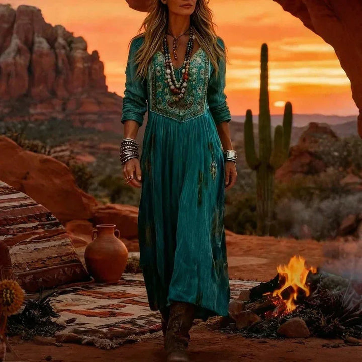 Women's teal maxi dress, embroidered with a V-neck, long sleeves, and a flowy cut, great for summer bohemian fashion.