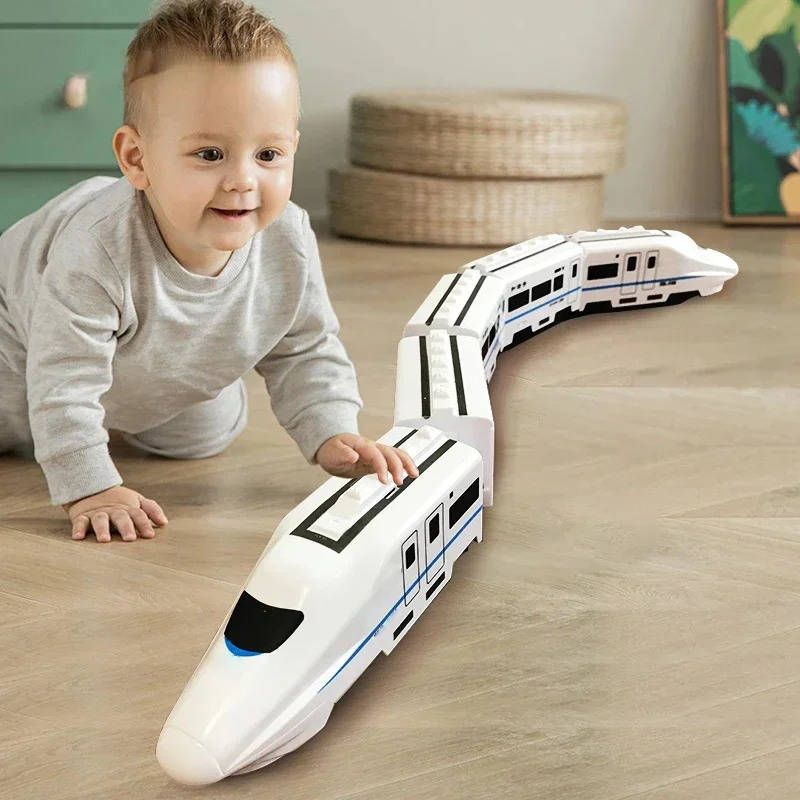 Close-up of toddler train set featuring colorful cars and interactive lights.