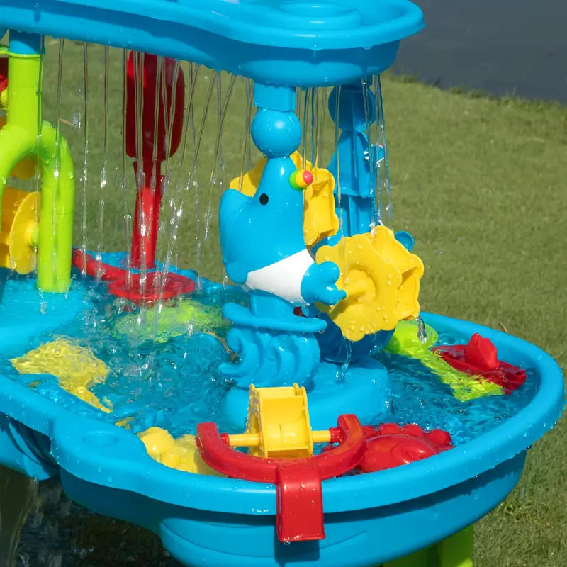 Children's Splash Fun Water Table providing cool summer fun and endless entertainment for kids in a backyard setting.