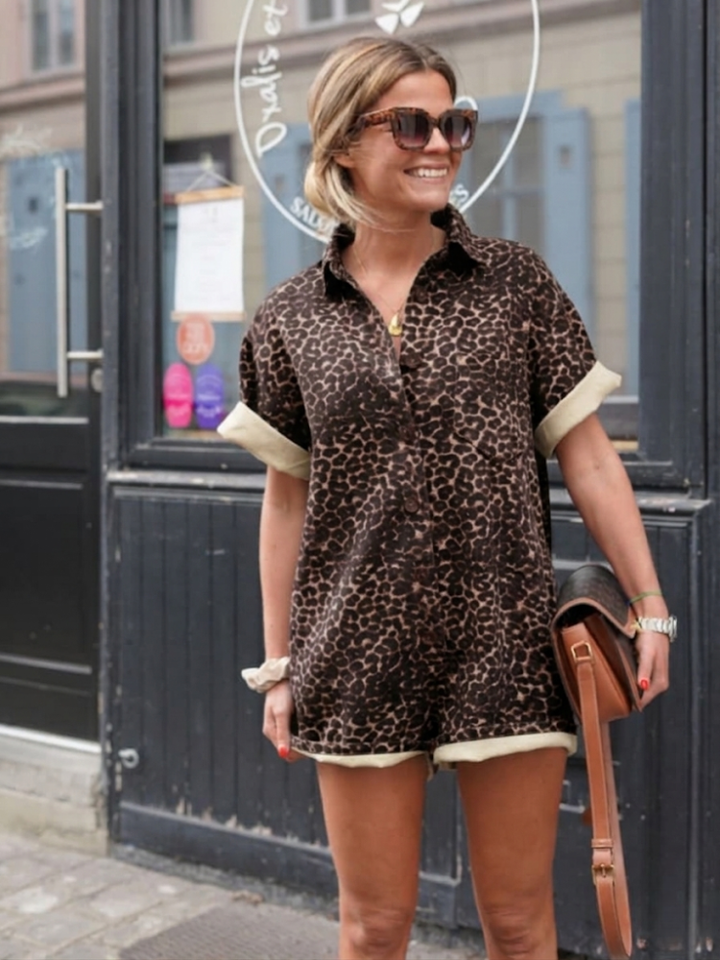 Stylish button-up cheetah print women's romper, ideal for a casual chic daytime or summer trendy outfit.