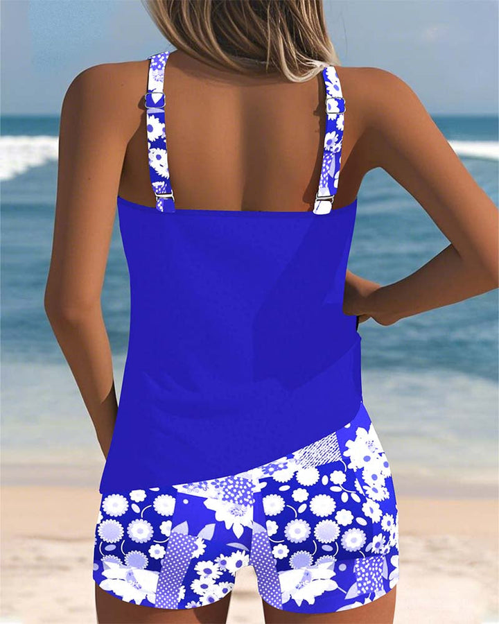 Vibrant printed women's two-piece swimsuit set. Comfortable and stylish beachwear for trendy summer fashion.