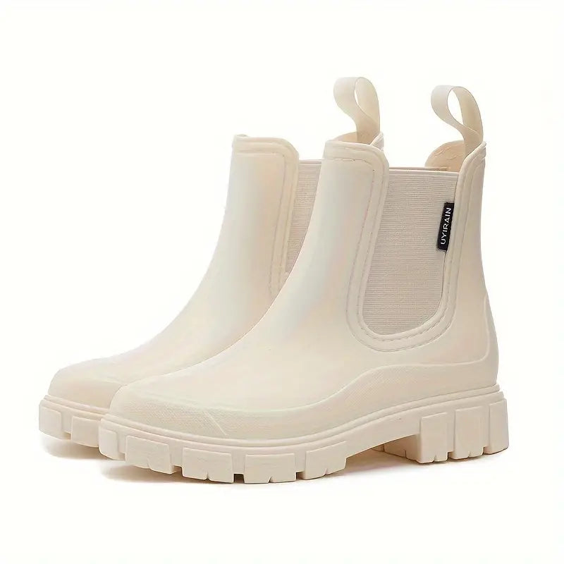 Fashion-forward women's waterproof rain boots. Trendy ankle boots for wet weather, combining style with outdoor protection.