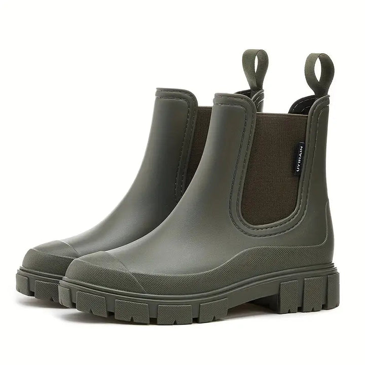 Chic women's rain boots with waterproof design. Trendy ankle boots offering stylish wet weather protection & comfort.