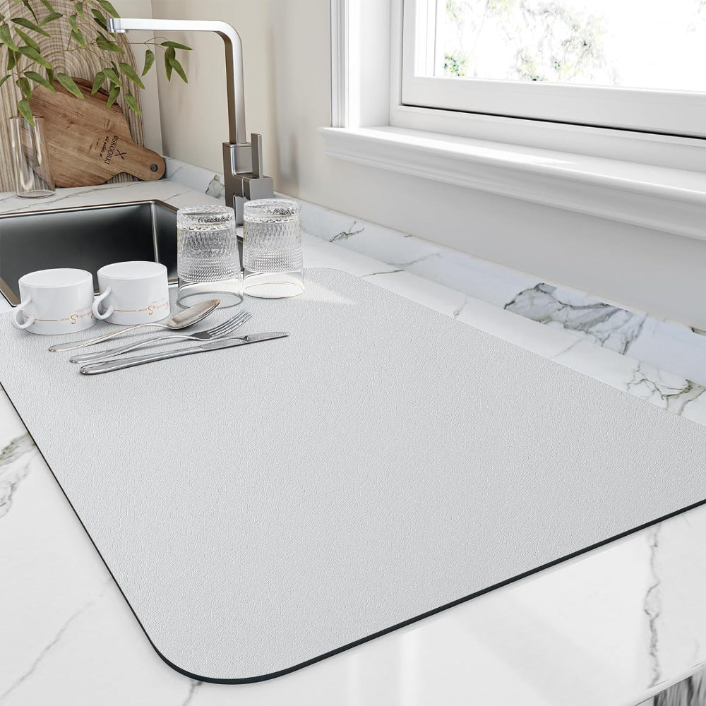 Absorbent diatomaceous draining mat, perfect sink accessory for fast-drying dishes & protecting surfaces.