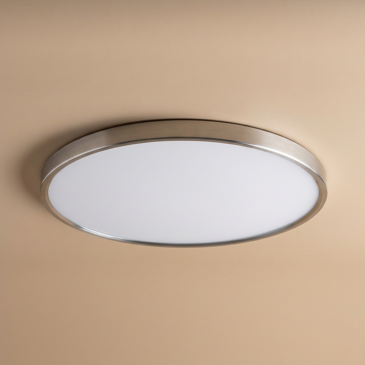 Elegant round LED ceiling light with gold trim, a slim modern fixture providing soft illumination.