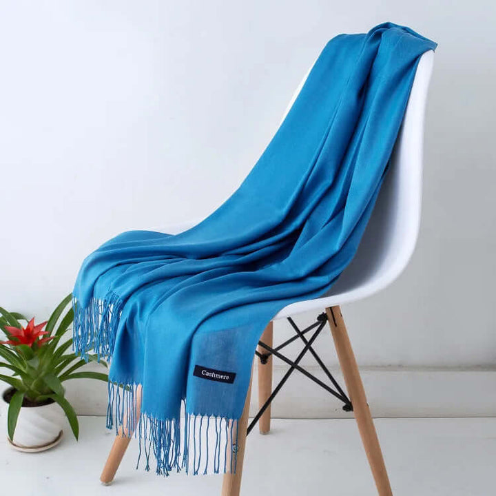 Woman wearing an ultra-soft luxury women's scarf, elegant, versatile, and stylish.