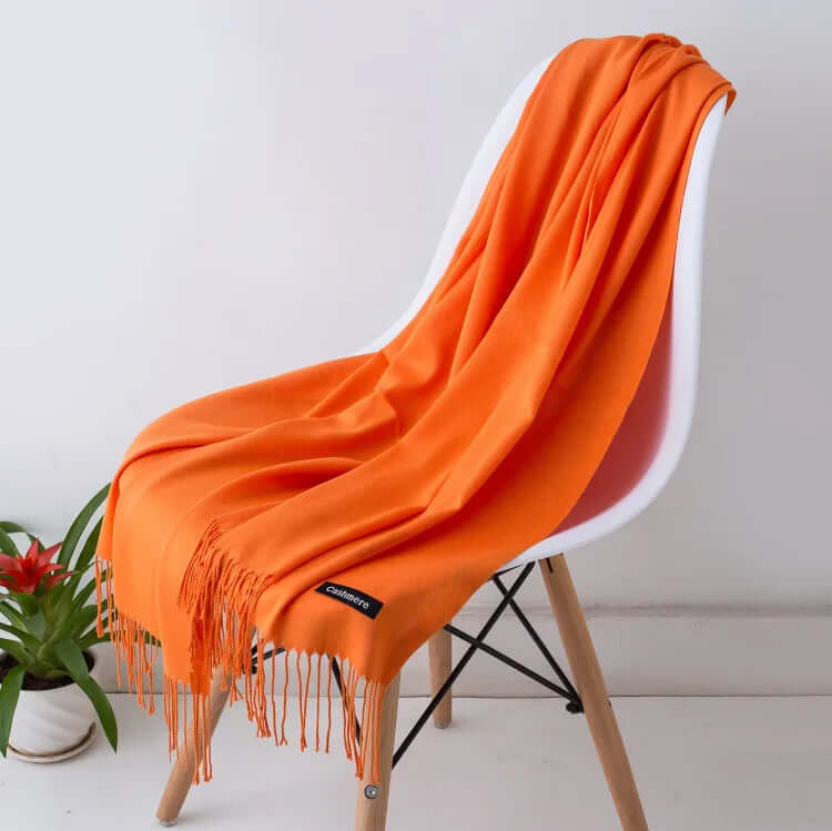 Rolled ultra-soft women's fashion scarf, compact, versatile, and elegant for travel.