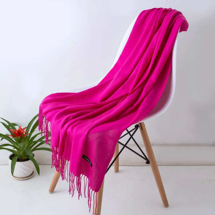 Beautifully draped ultra-soft women's luxury scarf, a chic and versatile accessory.