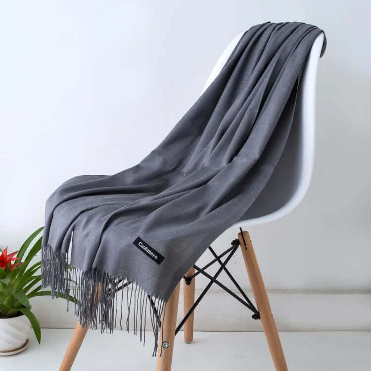 Elegant ultra-soft women's luxury scarf styled on a mannequin, a chic accessory.