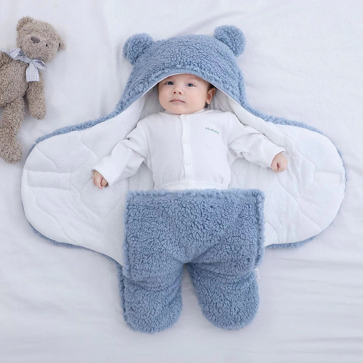 Cozy bear ear quilted swaddle, perfect for keeping babies warm in winter