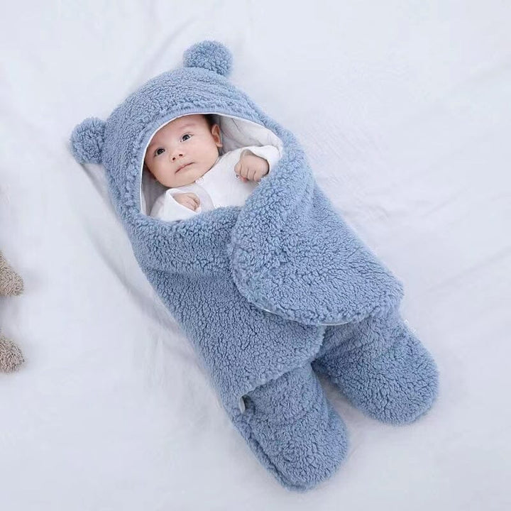 Plush baby sleeping bag featuring adorable bear ears for comfortable infant sleep