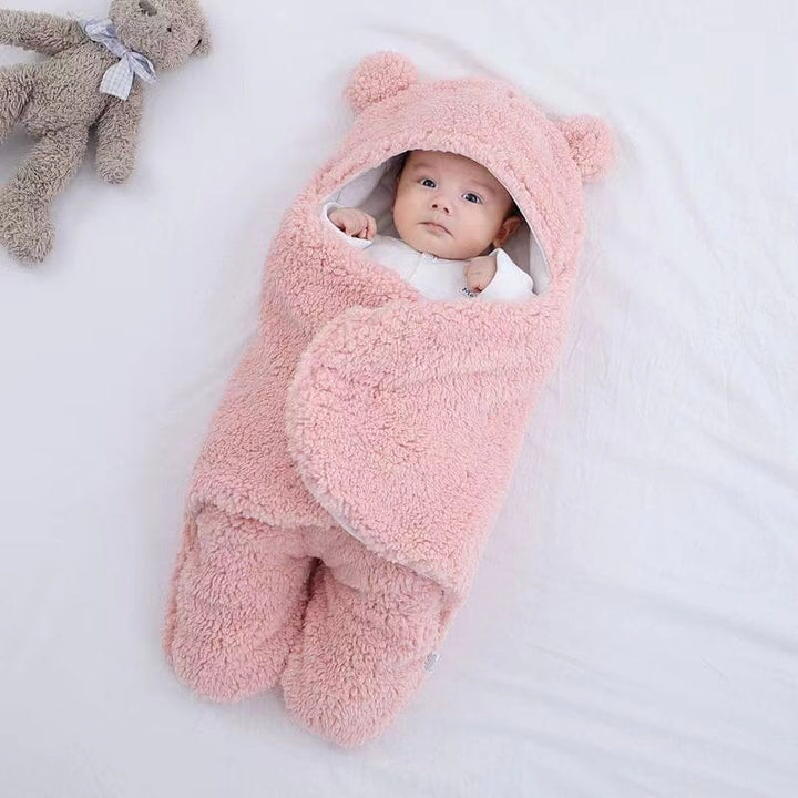 Unisex plush baby swaddle with charming bear ear design, ideal for winter