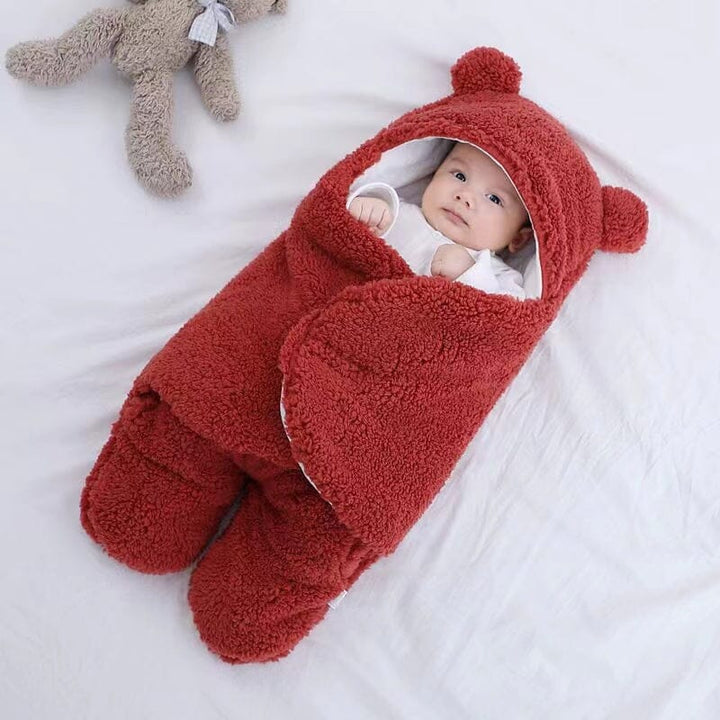 Warm and snuggly plush swaddle for babies, adorned with cute bear ears