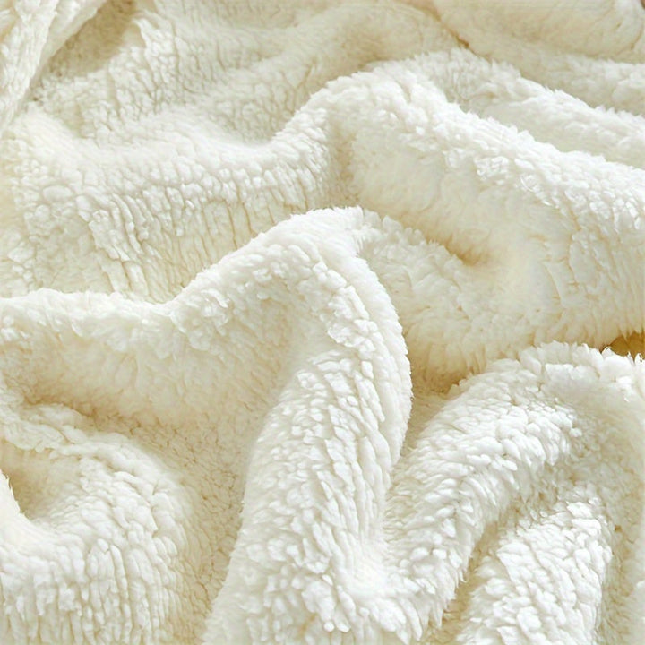 Reversible polyester sherpa fleece blanket, ultra soft & cozy for warmth and comfort.