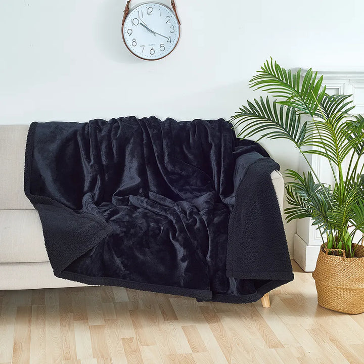 Cozy sherpa and flannel pet blanket, ideal as a washable dog bed.