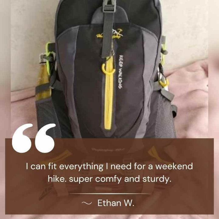 Man wearing 40L waterproof hiking backpack on a scenic mountain trail.