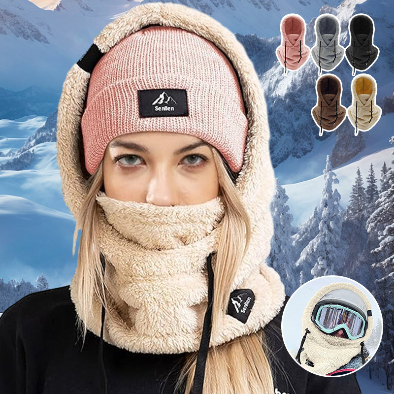 Person hiking in snow wearing a warm, windproof ArcticShield 3-in-1 winter hat with neck warmer.