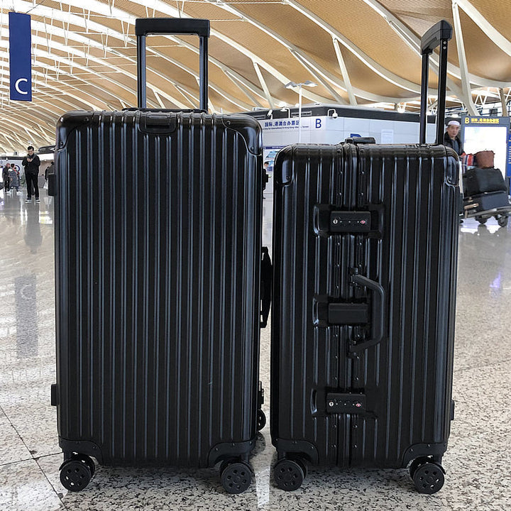 Unisex black hardshell luggage suitcase with spinner wheels for seamless airport travel.