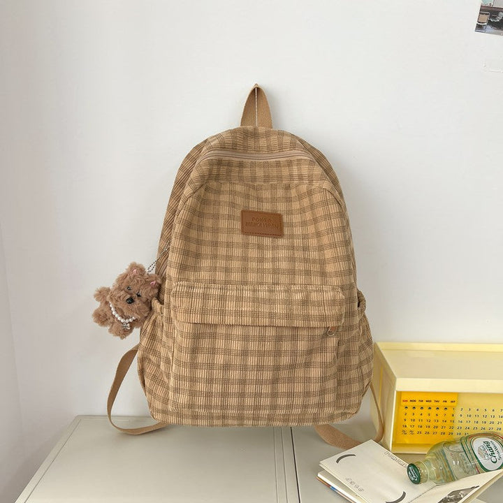 Unisex casual checkered school backpack for students. Stylish daily travel bag with ample storage.