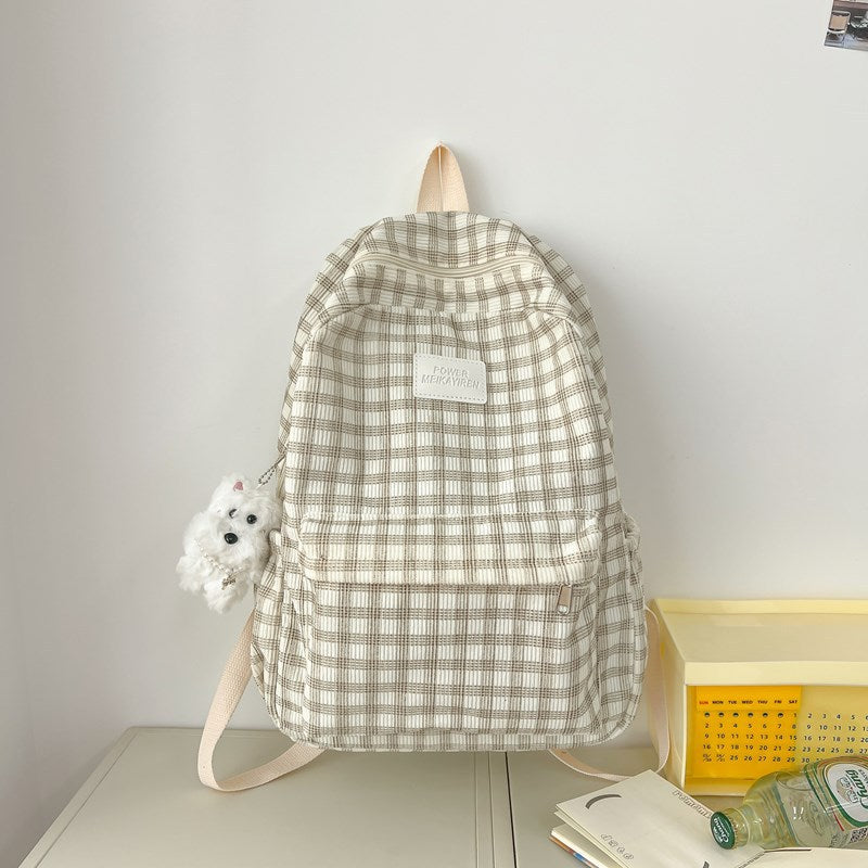 Unisex checkered student backpack with spacious compartments for books & laptop. Comfortable & practical school bag.