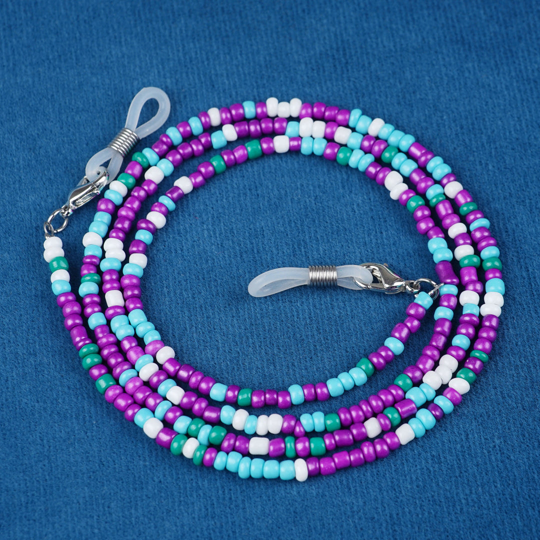 Close-up of a vibrant beaded glasses holder, a trendy accessory for eyewear.