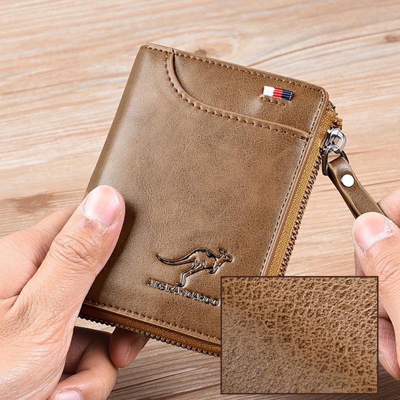 Black unisex compact RFID wallet held, showcasing its slim profile and secure snap closure.