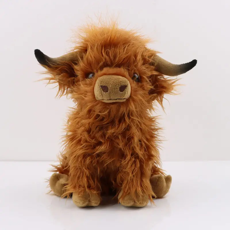 Unisex cuddly Highland cow plush toy, a soft stuffed animal comforter for kids.