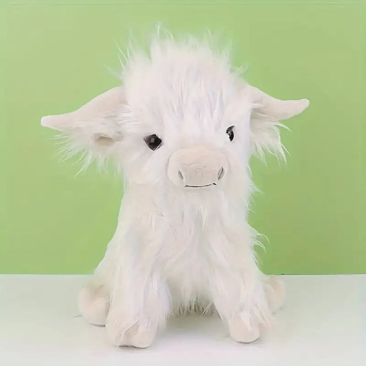 Close-up of a cuddly Highland cow stuffed animal, highlighting its soft texture.