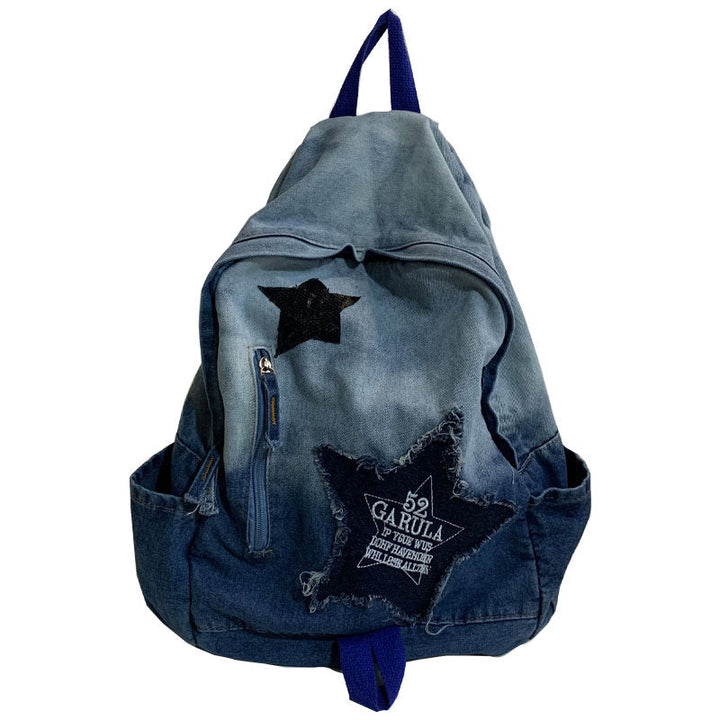Unisex denim backpack with star appliqué, perfect for school or casual everyday carry. Durable student essential.