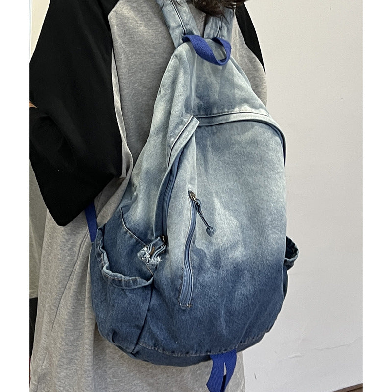 Modern unisex denim star appliqué backpack, ideal for school, travel & casual use. A functional & fashionable bag.