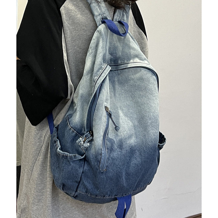 Modern unisex denim star appliqué backpack, ideal for school, travel & casual use. A functional & fashionable bag.