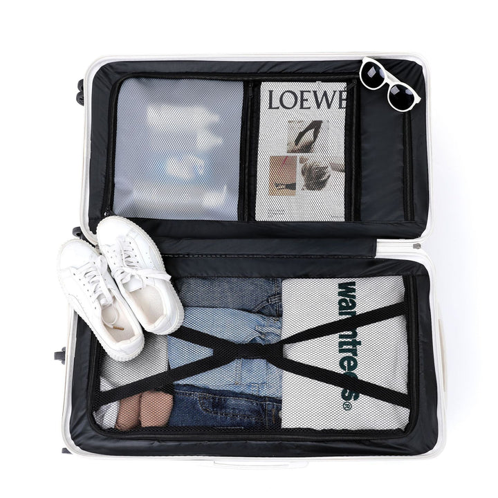 Organized unisex suitcase for vacation, featuring durable shell & handy drink holder.