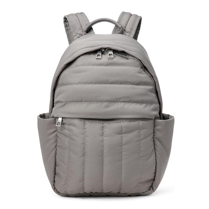 Unisex ergonomic backpack in black, front view, showing main compartment & comfortable shoulder straps for daily use.